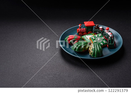 Sweet Madeleines desserts covered with chocolate in Christmas colors Sweet Madeleines desserts covered with chocolate in Christmas colors 122291379