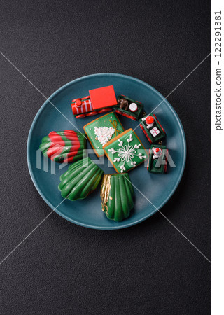Sweet Madeleines desserts covered with chocolate in Christmas colors 122291381