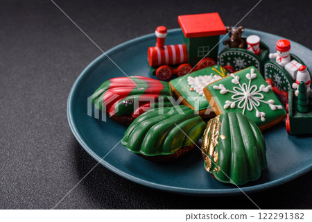 Sweet Madeleines desserts covered with chocolate in Christmas colors 122291382
