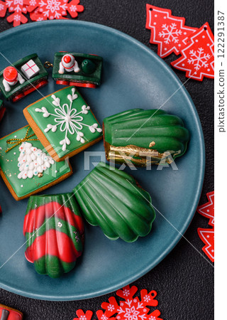 Sweet Madeleines desserts covered with chocolate in Christmas colors 122291387