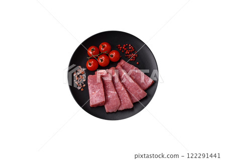 Juicy beef cut into slices with salt, spices and herbs 122291441