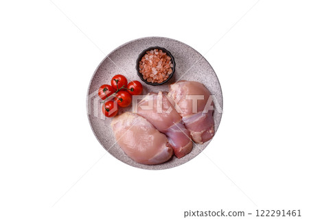 Fresh raw chicken thigh fillets with salt, spices and herbs 122291461