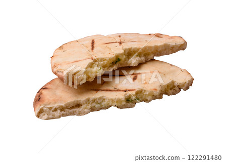 Round flatbread or pita with cheese, herbs, salt and spices Round flatbread or pita with cheese, herbs, salt and spices 122291480