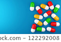 bright and colorful pills on a blue background. 3d illustration. background for a presentation about medicine and health 122292008