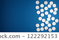 Blue background with white pills. 3D illustration. Presentation medicine and health. 122292153