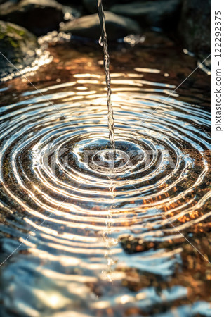 clear water flows forming circles 122292375