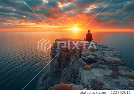 Sunset Meditation on a Rugged Cliff by the Sea 122292611