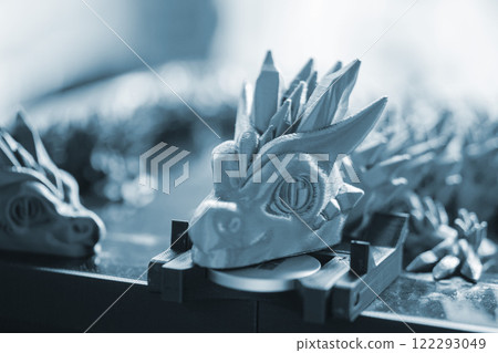 Art object printed on 3D printer close-up. Art creative model created on 3D printer from molten plastic closeup. Three-dimensional 3D printing. Modern new 3D printing technologies. Additive technology 122293049