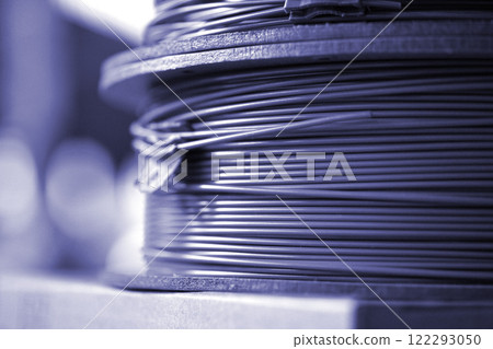 Spool of plastic filament for 3D printing. Spools of filament for melting in process of FDM 3D printing. 3D Printing FDM technology. Modern 3d printing technologies. Additive progressive technologies 122293050