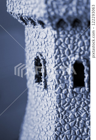 Creative object printed on 3D printer. Three-dimensional model of tower created on 3D printer. 3D model printed on 3D printer from molten plastic. Printing FDM technology. Additive technologies Creative object printed on 3D printer. Three-dimensional model of tower created on 3D printer. 3D model printed on 3D printer from molten plastic. Printing FDM technology. Additive technologies 122293063