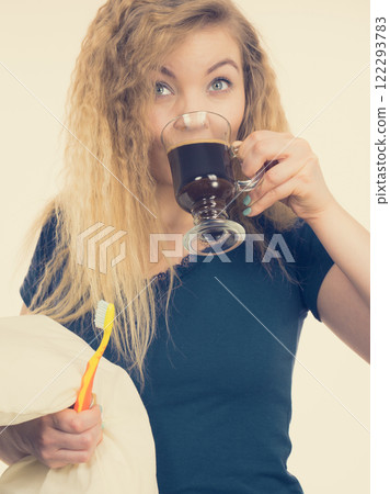 Funny woman being late drinking coffee 122293783