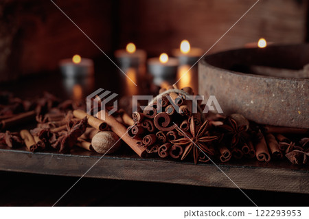 Cinnamon sticks, anise, and nutmeg on a old wooden table. Cinnamon sticks, anise, and nutmeg on a old wooden table. 122293953