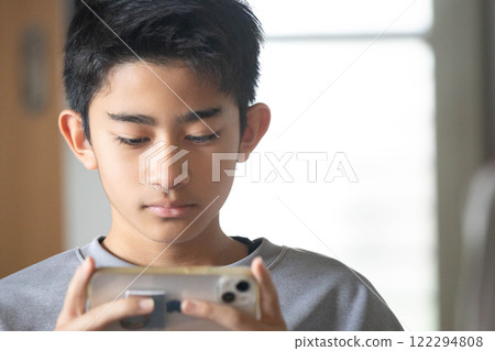 A man operating a smartphone 122294808