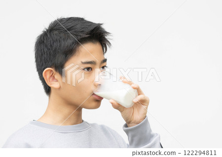 Image of a young man drinking milk 122294811