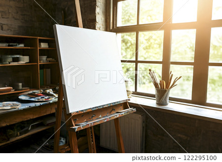 A canvas placed by the window in the studio A canvas placed by the window in the studio 122295100