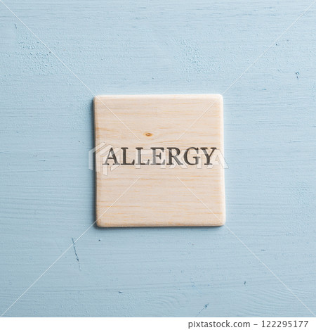 Wooden tile with an Allergy sign on it Wooden tile with an Allergy sign on it 122295177