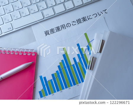 Graphs, documents, keyboard and notebook on the table 122296671