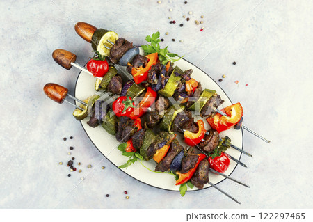 Barbecued meat with garnish. 122297465