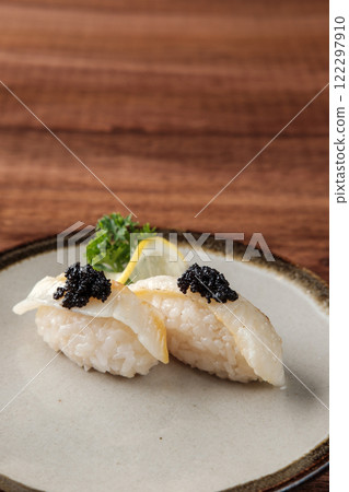 White Fish Sushi with Caviar Served on a Plate 122297910