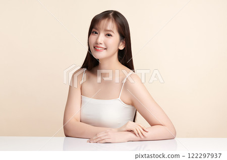 Beautiful young asian woman with clean fresh skin on beige background, Face care, Facial treatment, Cosmetology, beauty and spa, Asian women portrait. 122297937
