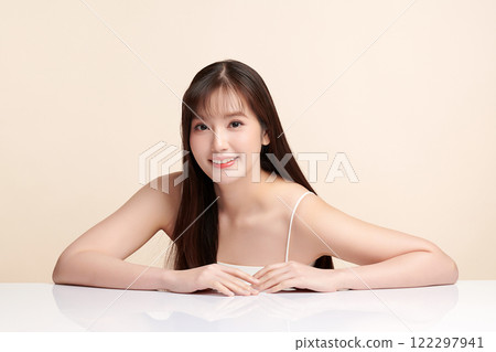 Beautiful young asian woman with clean fresh skin on beige background, Face care, Facial treatment, Cosmetology, beauty and spa, Asian women portrait. 122297941