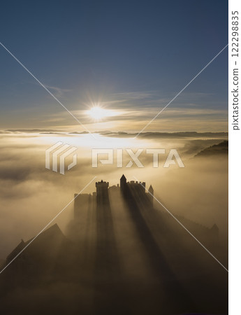 Beynac Chateau rises above morning fog at sunrise in Dordogne, France 122298835