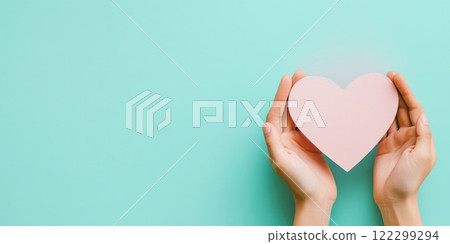 Close-up of woman holding heart paper 122299294