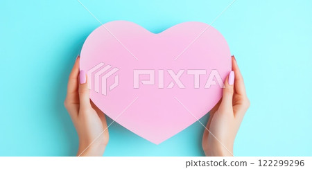 Woman showing blank heart paper mockup 122299296
