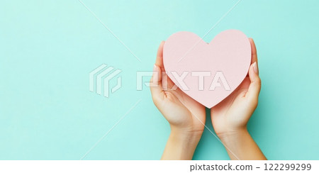 Holding a blank heart paper mockup close-up Holding a blank heart paper mockup close-up 122299299