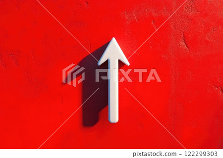 White Arrow Symbol on Bright Red White Arrow Symbol on Bright Red 122299303
