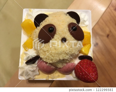 A cake in the shape of a panda's face served on a square plate A cake in the shape of a panda's face served on a square plate 122299381