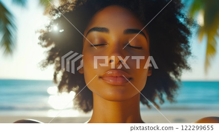 Ebony Woman Practicing Hatha Yoga on a Serene Beach 122299655