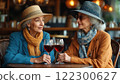two elderly women in a caf drinking wine 122300627