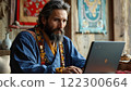 A doctor from Tibet gives a lecture on a laptop. 122300664