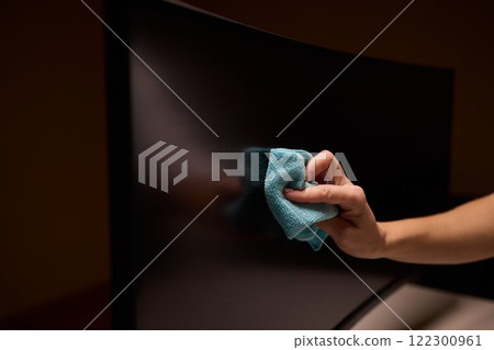 Effective and Safe Cleaning Techniques for a Curved Television Screen Using a Microfiber Cloth 122300961