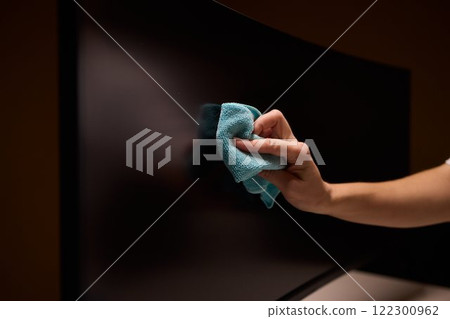 Effective and Safe Cleaning Techniques for a Curved Television Screen Using a Microfiber Cloth 122300962