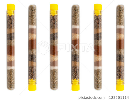 Detail spices in spice rack. Kitchen spices in glass jar. Colored spices rack isolated on white background Detail spices in spice rack. Kitchen spices in glass jar. Colored spices rack isolated on white background 122301114