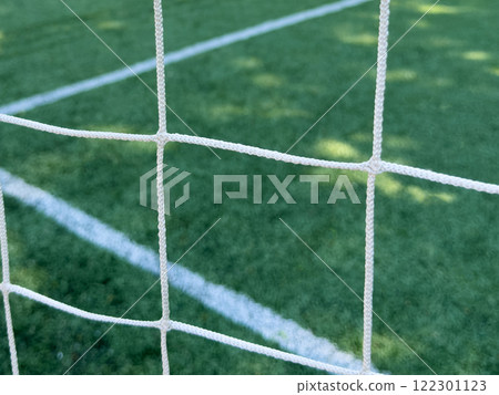 Close-up of a football net.Net on a football goal. Background of football, soccer net. Close-up of Soccer Goal Net 122301123