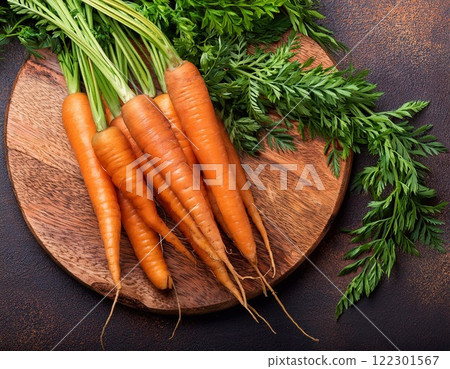 A lot of fresh carrots with leaf on wooden floor. Healthy and benefits of Carrot 122301567