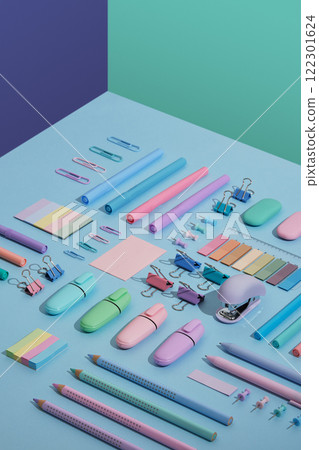 Stationery backdrop with markers, felt-tip pens, paper clips, erasers, stickers in pastel colors neatly laid on blue, mint green and violet background. Selective focus. Stationery backdrop with markers, felt-tip pens, paper clips, erasers, stickers in pastel colors neatly laid on blue, mint green and violet background. Selective focus. 122301624