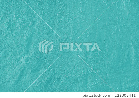 Textured turquoise plaster wall surface with brushstroke, painted, aged concrete background 122302411