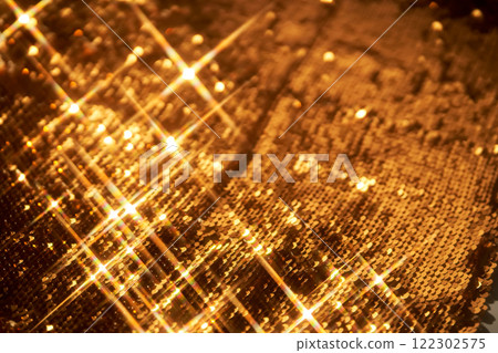 Abstract festive gold background made of sequins. Abstract festive gold background made of sequins. 122302575