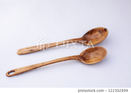 Wooden kitchen utensils stacked view close up isolated Wooden kitchen utensils stacked view close up isolated 122302899