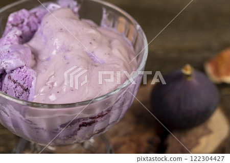 cold sweet fig flavored ice cream and ripe purple figs on the table cold sweet fig flavored ice cream and ripe purple figs on the table 122304427