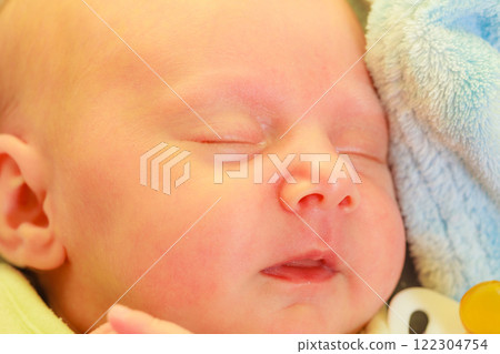 Little newborn baby sleeping calmly in blanket 122304754