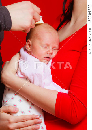 Little newborn baby sleeping on mother chest 122304763