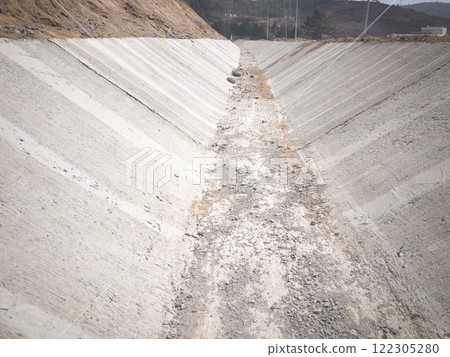 Newly built concrete rain water drainage tray 122305280