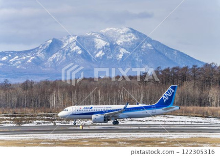 Planes at New Chitose Airport and Mount Fusubushi in winter, Chitose, Hokkaido 122305316