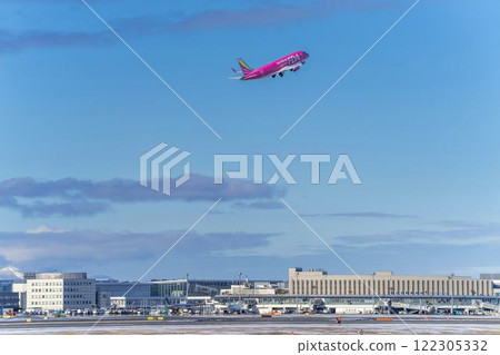 New Chitose Airport in winter, airplane taking off, Chitose, Hokkaido 122305332