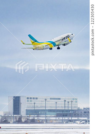 New Chitose Airport in winter: Snow smoke and planes taking off, Chitose, Hokkaido New Chitose Airport in winter: Snow smoke and planes taking off, Chitose, Hokkaido 122305430
